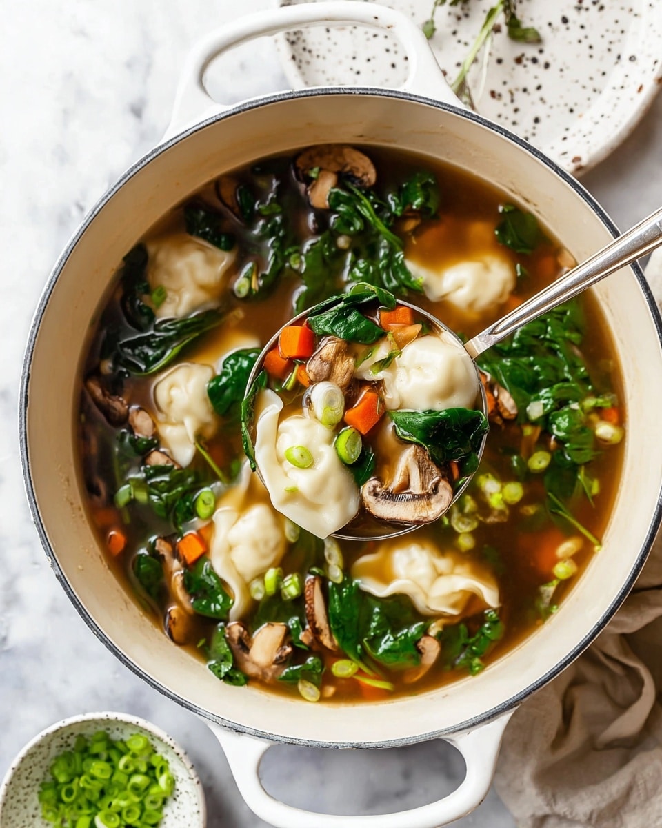 A white pot filled with clear brown broth, showing soft white dumplings floating along with small light brown mushroom halves, bright green spinach leaves, and small diced orange carrots, with some light green chopped scallions mixed in. A large silver spoon lifts a serving containing two dumplings surrounded by mushrooms, spinach, carrots, and scallions. The pot rests on a white marbled surface, with a white plate speckled with black spots nearby and a small bowl with fresh green chopped scallions in the background. Photo taken with an iphone --ar 4:5 --v 7