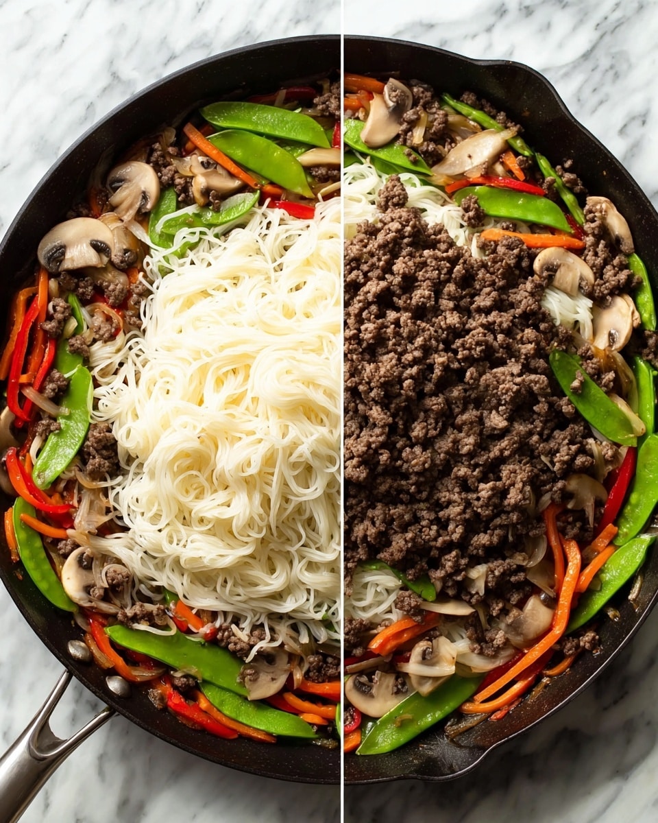 The image shows a black skillet on a white marbled surface containing a stir-fry dish. The first layer has sliced mushrooms, snap peas, orange and red bell pepper strips, and onions, all vibrant and fresh. The second layer is a heap of cooked ground beef piled in the center, brown and crumbly. The skillet handle extends outwards at the bottom left. In the second part of the image, a large nest of white noodles is placed on top of the beef and vegetables, soft and slightly tangled, covering most of the middle section of the dish. The colors contrast well with the dark skillet and white marbled background. Photo taken with an iphone --ar 4:5 --v 7