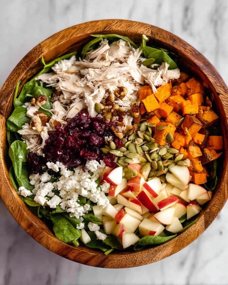 Fall Harvest Salad with Roasted Sweet Potatoes, Chicken, Apples, Cranberries, Pumpkin Seeds, and Goat Cheese Recipe