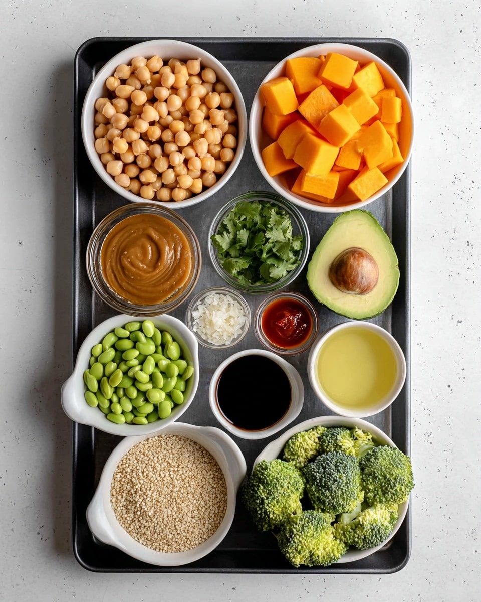 The image shows a dark tray with ten small white bowls and one avocado half arranged neatly on a white marbled surface. Starting from the top left, there is a bowl filled with light brown chickpeas next to it is a bowl with orange cubes of butternut squash. Below the chickpeas, a bowl contains green edamame beans, and next to it is a bowl with light green chopped cilantro. In the center left, a clear bowl holds a brown peanut sauce, with a small bowl of thick soy sauce next to it. To the right of the soy sauce, a small bowl contains finely minced garlic, and below that a small bowl has a reddish hot sauce. Below the peanut sauce is a white bowl filled with a light yellow liquid, likely oil. Next to it, in the center right, a bowl is filled with green broccoli florets. At the bottom center, a small bowl holds white quinoa grains, and to the right of it is the avocado half with light green flesh visible. The setup is clean and colorful, with a fresh and healthy vibe. Photo taken with an iphone --ar 4:5 --v 7