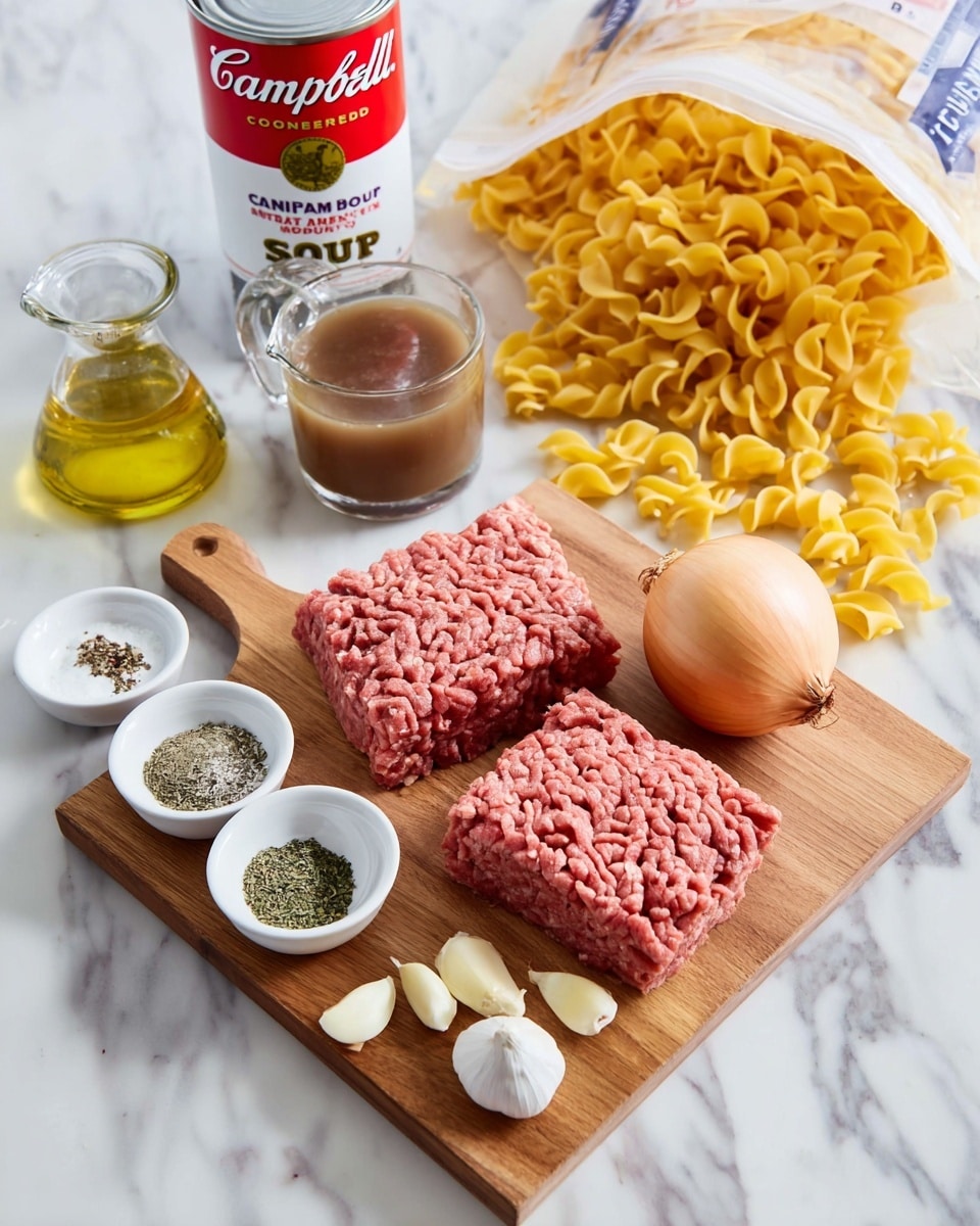 A wooden board placed on a white marbled surface holds ingredients for a meal: two thick, rectangular portions of raw ground beef with a textured pattern, a peeled whole yellow onion on the right, and three peeled garlic cloves at the front. There are three small white bowls on the board: one with a mix of salt and black pepper, one with green dried herbs, and one with golden olive oil. Behind the board, there is a clear glass measuring cup filled with dark brown beef broth, a can of Campbell's Cream of Mushroom soup with the lid open showing the creamy inside, and a large white bag of uncooked yellow egg noodles spilling across the white marbled surface. The scene is bright and clean. Photo taken with an iphone --ar 4:5 --v 7