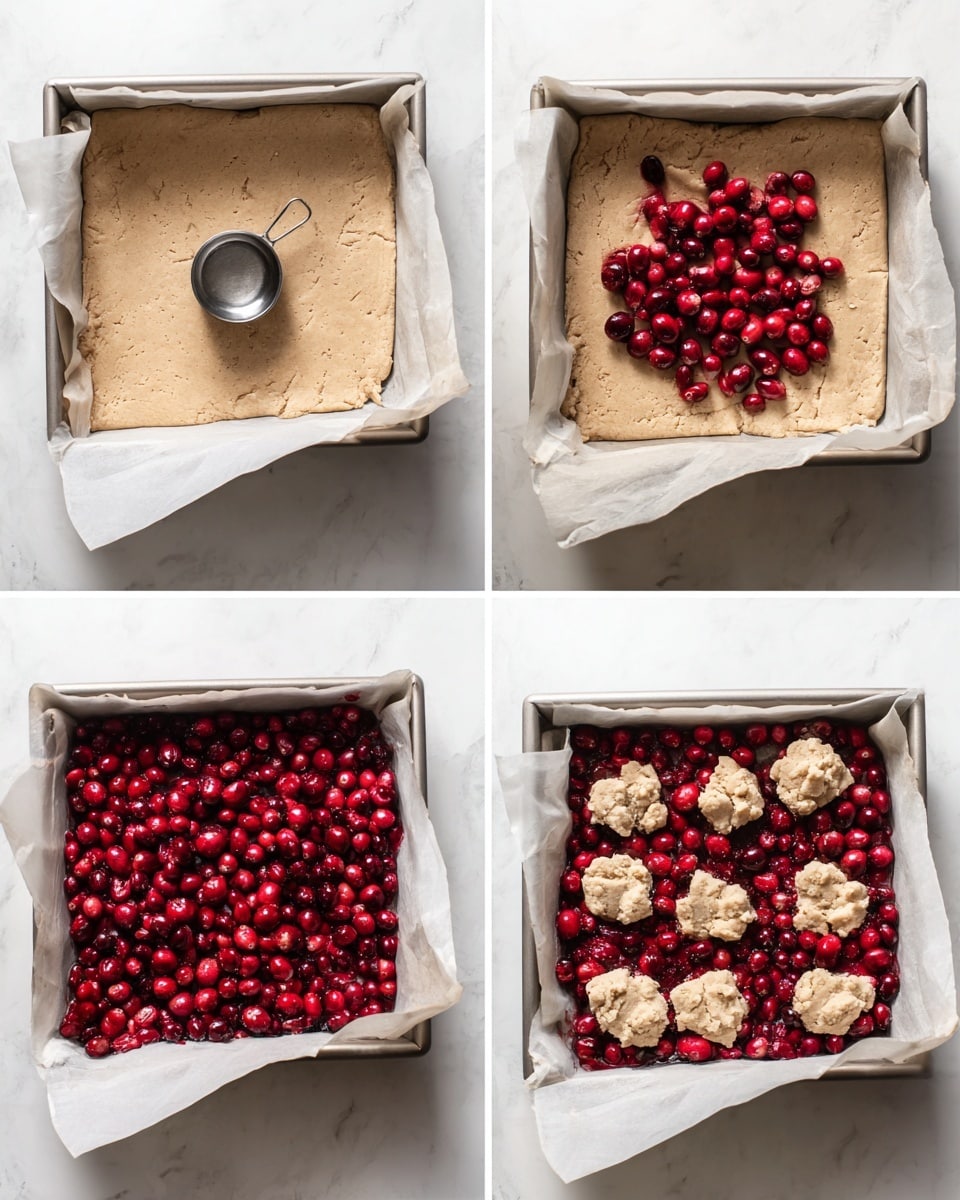 The image shows a square white baking pan with parchment paper lining. In the first view, a flat dough layer with a light beige color and slightly textured surface fills the pan, with a silver measuring cup placed in the center. In the second view, the dough base remains, now topped with a small pile of bright red and dark red cranberries in the middle. The third view shows the dough base fully covered with a thick, even layer of fresh cranberries, their shiny skins adding vibrant red hues. The final view has dollops of uneven, light beige dough scattered on top of the cranberry layer, giving a rustic appearance with rough edges and a slightly cracked surface. The pan rests on a white marbled textured surface. Photo taken with an iphone --ar 4:5 --v 7