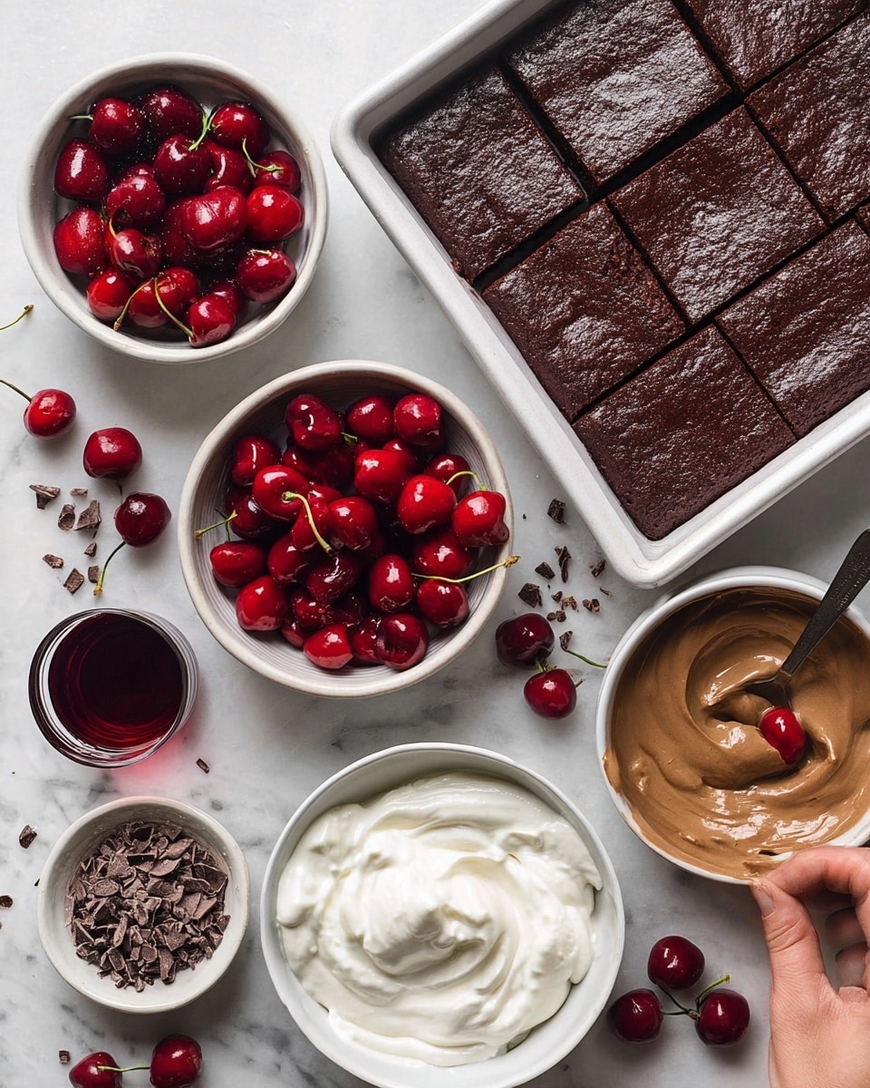 The image shows ingredients for a layered dessert arranged on a white marbled surface. There is a rectangular dark brown chocolate cake in a baking pan, already cut into small square pieces with one woman's hand lifting a piece. Around it, there are four white bowls: one filled with bright red, glossy cherries in syrup with a spoon, one with smooth light brown chocolate pudding, one with white whipped cream, and one with small chocolate shavings. Some fresh cherries with stems are also scattered near the bowls. A small glass of dark red liquid, possibly cherry juice or wine, sits next to the cake. photo taken with an iphone --ar 4:5 --v 7