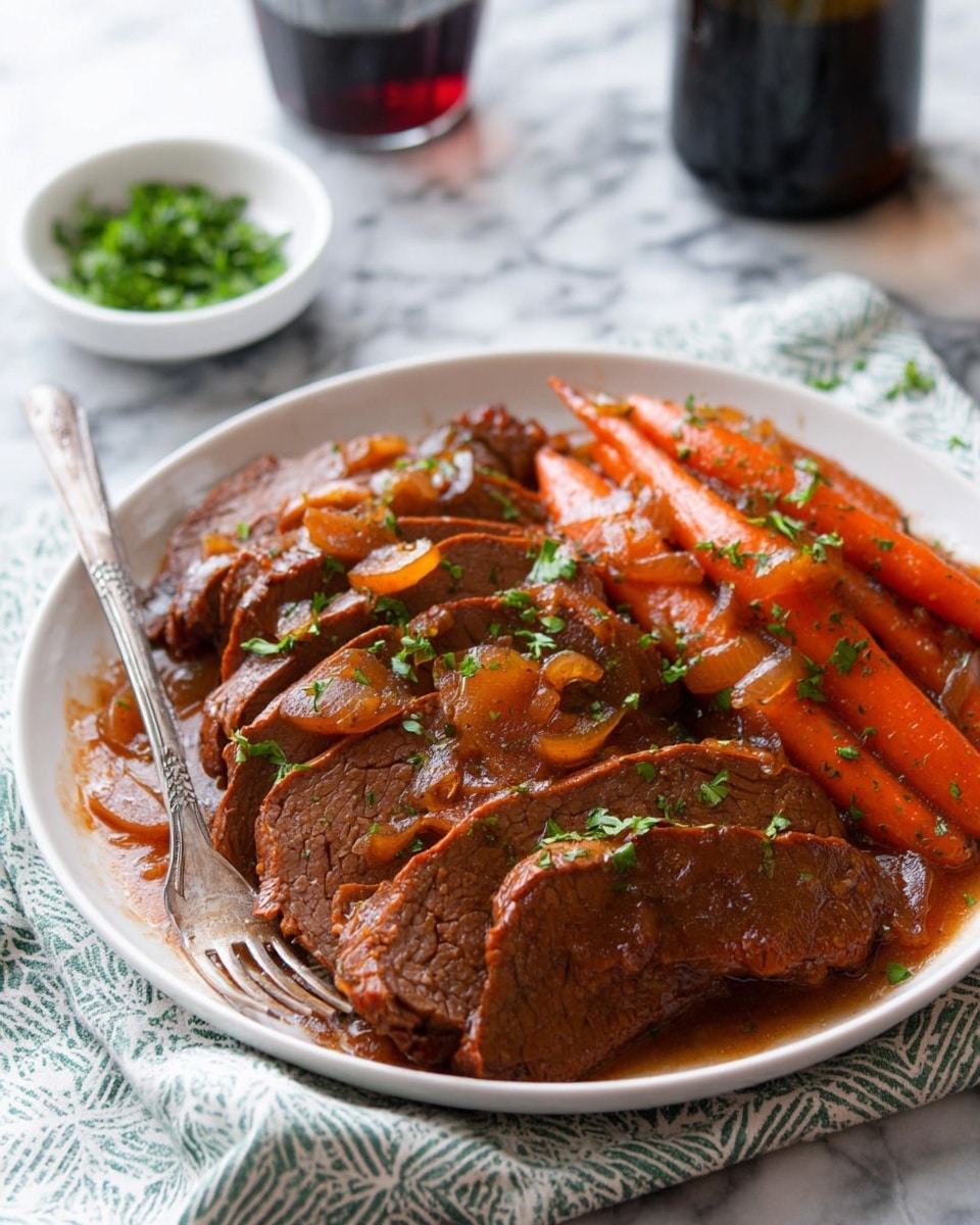 A white plate is filled with several slices of cooked beef layered side by side, showing a rich brown color with a slightly shiny texture. The beef is bathed in a dark reddish-brown sauce with visible cooked onion pieces scattered over and around it. On one side of the beef, there are whole cooked carrots covered in the same sauce, adding a bright orange color contrast. Small chopped green herbs are sprinkled lightly over the entire dish for a fresh look. A fork rests on the edge of the plate. The setting includes a patterned cloth napkin under the plate on a white marbled surface, with a small bowl of green herbs and a dark bottle blurred in the background. photo taken with an iphone --ar 4:5 --v 7