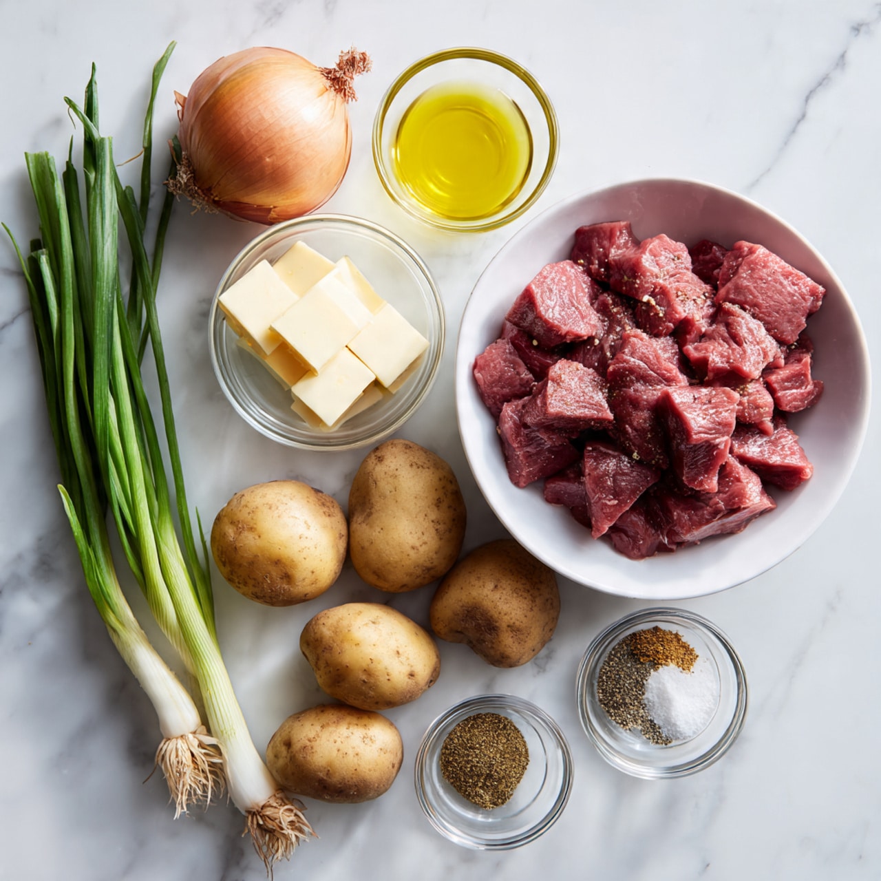 The image shows a white bowl filled with chopped pink cooked meat placed near a whole onion, two green onion stalks, and five light brown potatoes scattered on a white marbled surface. There are also three small clear glass bowls, one containing a yellow cube of butter, another with light green olive oil, and the last bowl has mixed spices of white, red, black, and beige colors. The ingredients are laid out neatly for cooking preparation. photo taken with an iphone --ar 4:5 --v 7