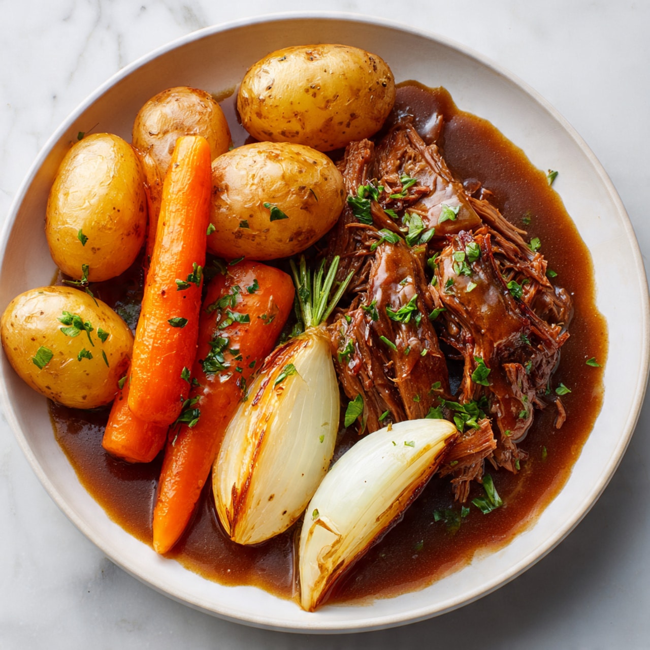 A white bowl holds a dish with three main layers: on the right, shredded brown meat covered partially by thick brown gravy; on the left, roasted orange carrot rounds and a white onion wedge with a slight char and some green herbs sprinkled on top; at the upper side of the bowl, halved small brown potatoes with smooth shiny skin and white flesh inside. The background is a white marbled texture. photo taken with an iphone --ar 4:5 --v 7