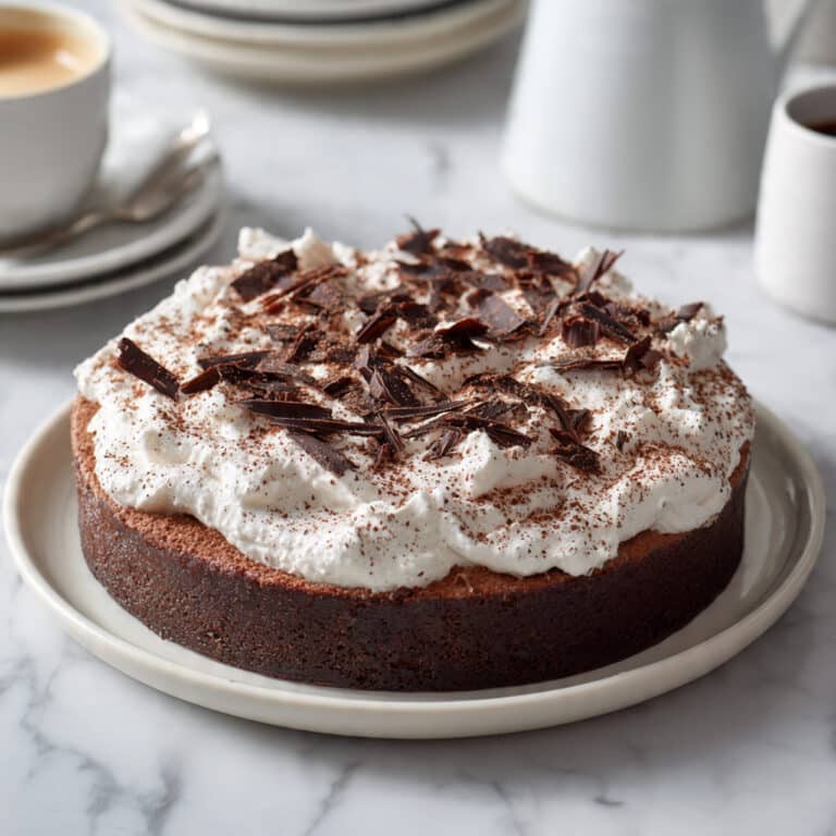 Flourless Chocolate Cake with Whipped Cream and Chocolate Garnish Recipe