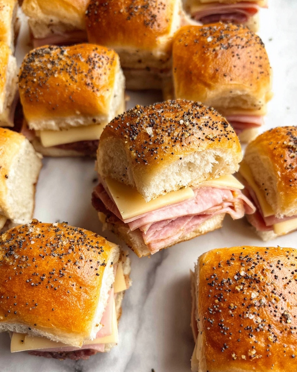 A group of twelve small sandwich squares arranged in a loose grid on a white marbled surface. Each sandwich has a golden-brown top bun covered with black poppy seeds and a slightly shiny texture, suggesting a light glaze or butter. Inside, there are two visible layers: a light pink layer of ham followed by a creamy, pale layer of melted cheese. The soft bread shows a slightly fluffy texture around the filling edges. The sandwiches are neatly cut but still close together, with some melted cheese visible between certain pieces. photo taken with an iphone --ar 4:5 --v 7