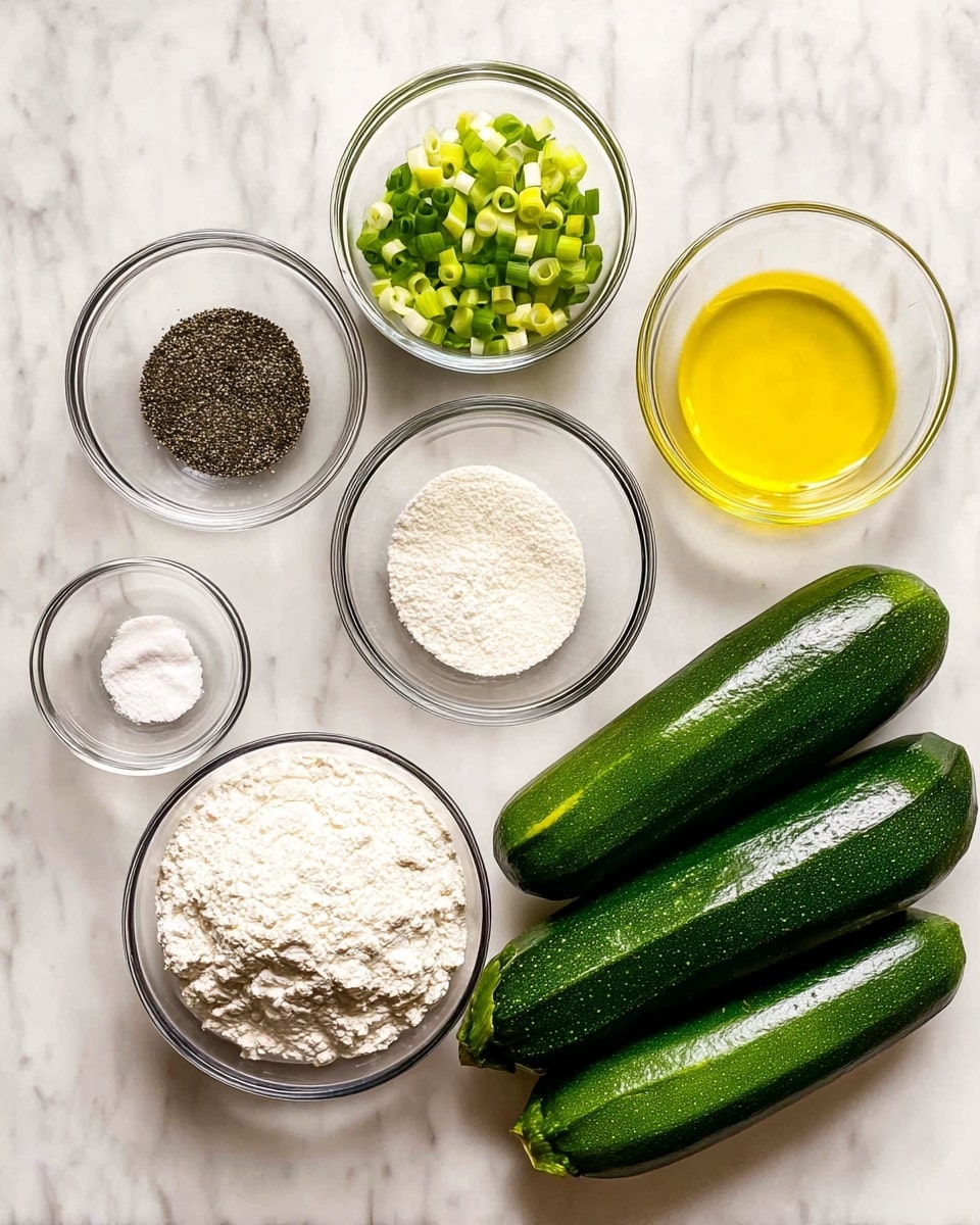 There are six clear glass bowls and four whole zucchinis arranged on a white marbled surface. The top row has three bowls: the left bowl contains black pepper, the middle bowl has chopped green onions with white and green rings, and the right bowl holds yellow olive oil. The bottom row has three bowls: the left bowl contains coarse salt, the middle bowl is filled with white flour with a rough texture, and the right bowl holds baking powder in powder form. To the right of the bowls, there are four whole zucchinis stacked in a slightly diagonal pile, showing their dark green shiny skin. Photo taken with an iphone --ar 4:5 --v 7