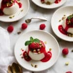 Creamy Vanilla Panna Cotta with Raspberry Coulis and Pistachio Garnish Recipe