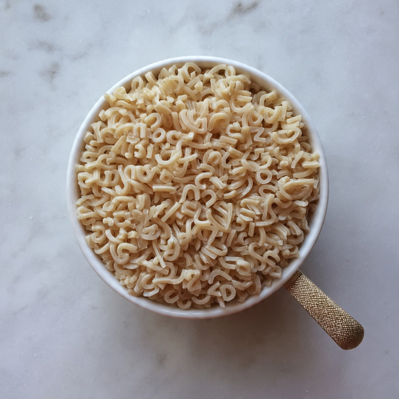 A white measuring cup filled with uncooked small alphabet pasta, showing a dense layer of light beige noodles shaped like letters, placed on a white marbled surface background, the measuring cup handle has a textured grip. photo taken with an iphone --ar 4:5 --v 7