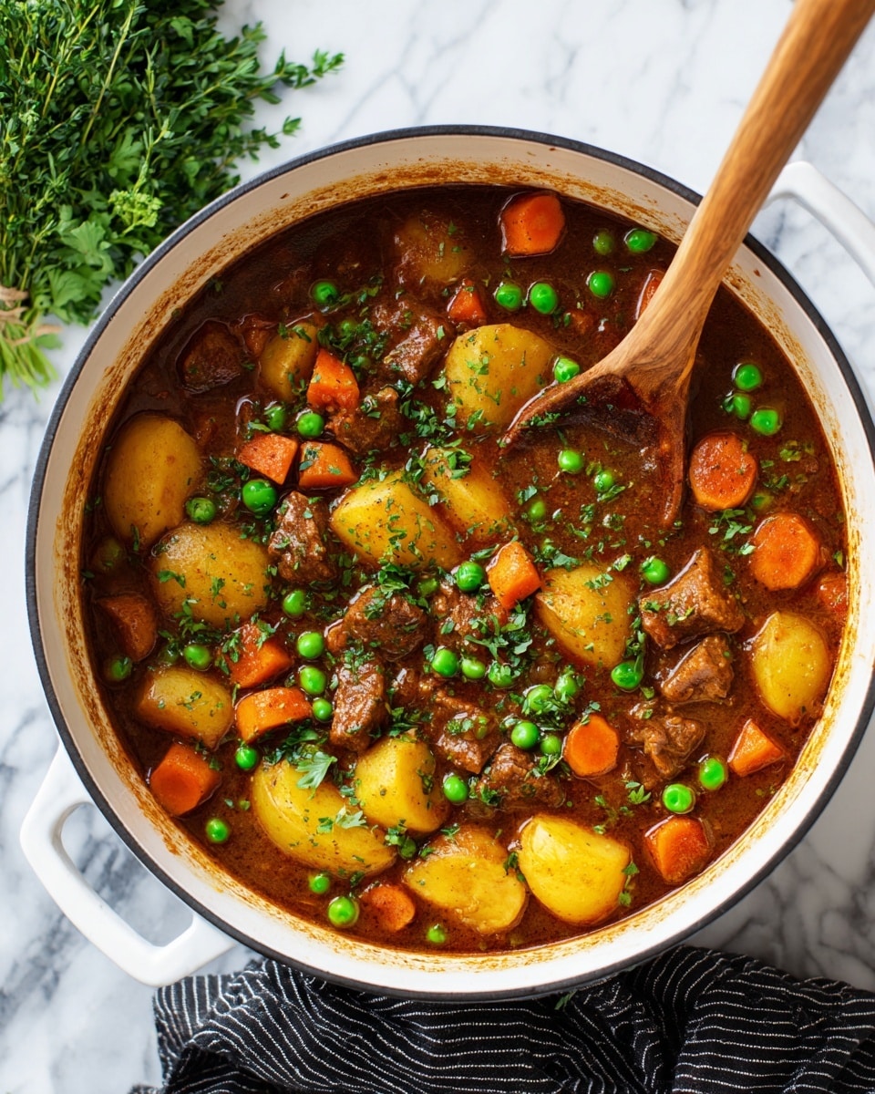 A white pot filled with a thick brown stew containing three main layers of ingredients: round yellow potato slices at the bottom layer, bright orange carrot pieces scattered throughout the middle, and fresh green peas floating mostly on the top layer. Small chunks of brown meat are mixed evenly in the stew, with green chopped herbs sprinkled on top for garnish. A wooden spoon rests inside the pot on the left side, partially submerged in the stew. The pot sits on a white marbled surface with a bunch of green herbs off to the top left and a black-and-white striped cloth on the bottom right. Photo taken with an iphone --ar 4:5 --v 7