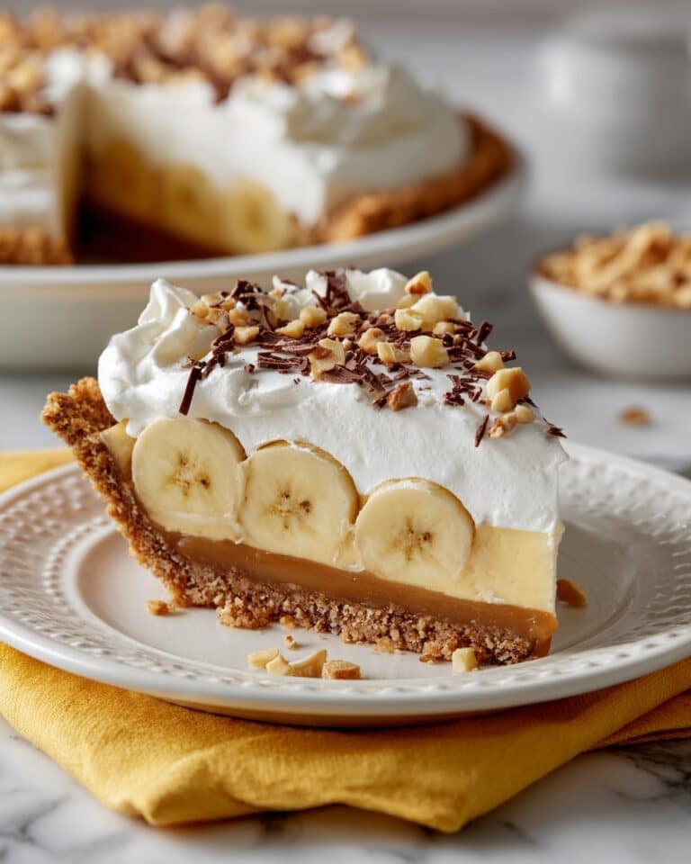 Decadent Banoffee Pie with Caramelized Filling, Banana Layers, and Whipped Cream Recipe