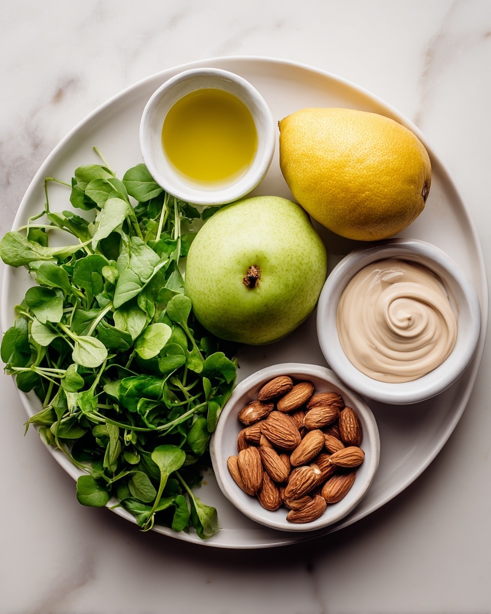 A round white plate holds fresh green watercress on the left side, next to a green pear and a green apple placed near the center. At the top, a whole yellow lemon is placed beside a small white bowl with olive oil and a smaller white bowl with seed mustard. Near the bottom right, there is a pile of brown almonds next to a small white bowl holding a swirl of light beige mayonnaise. The plate is set on a white marbled surface. Photo taken with an iphone --ar 4:5 --v 7