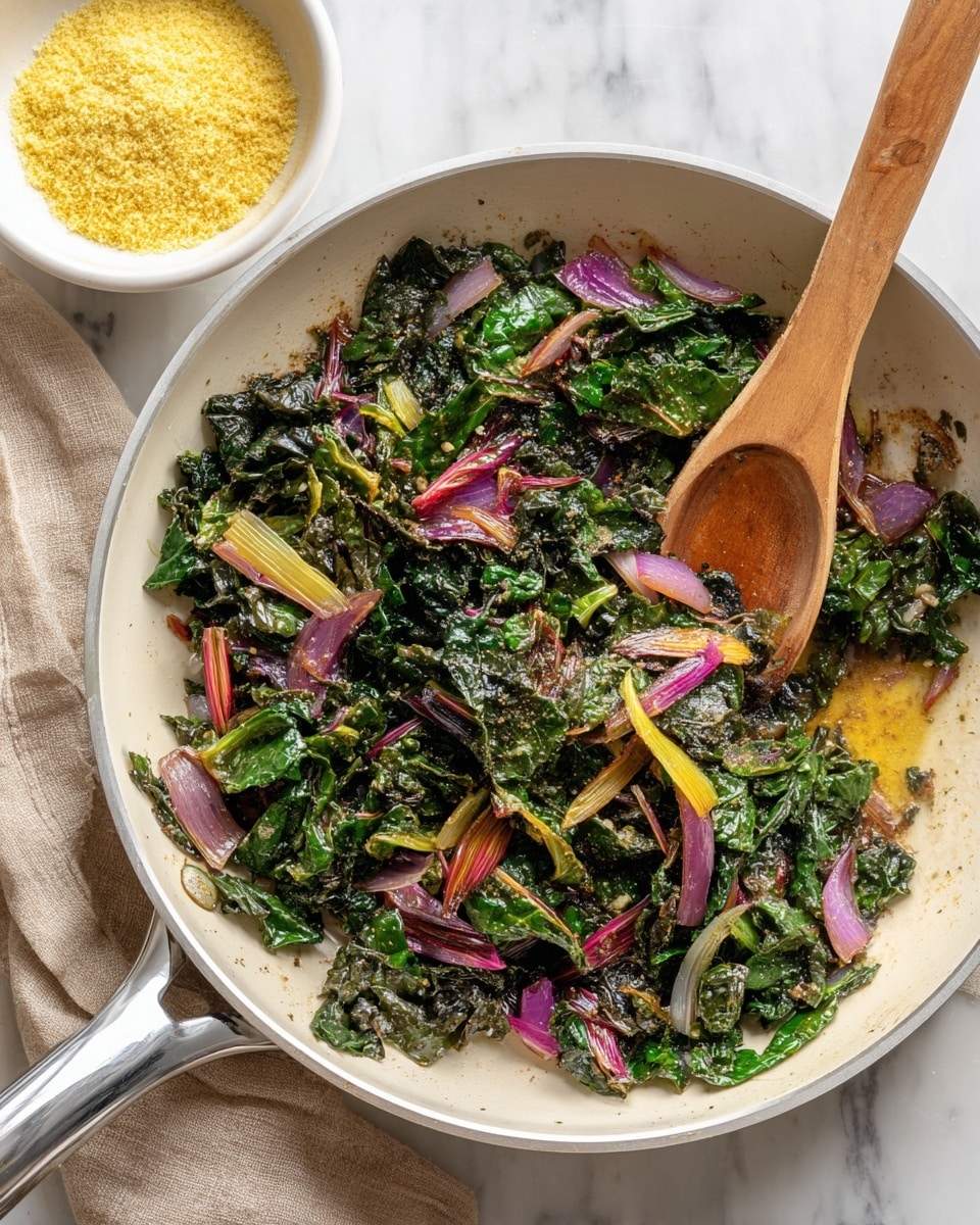 The image shows cooked leafy greens with red and yellow stems mixed with small pieces of cooked purple onion in a white frying pan with a metal handle. A wooden spoon is resting inside the pan, blending with the greens and onions. Next to the pan is a small white bowl filled with a grated light yellow topping on a white marbled surface. The overall colors include dark green from the leaves, reddish and yellowish tones from the stems, and the soft purple of the onions, creating a mix of fresh and cooked textures. Photo taken with an iphone --ar 4:5 --v 7