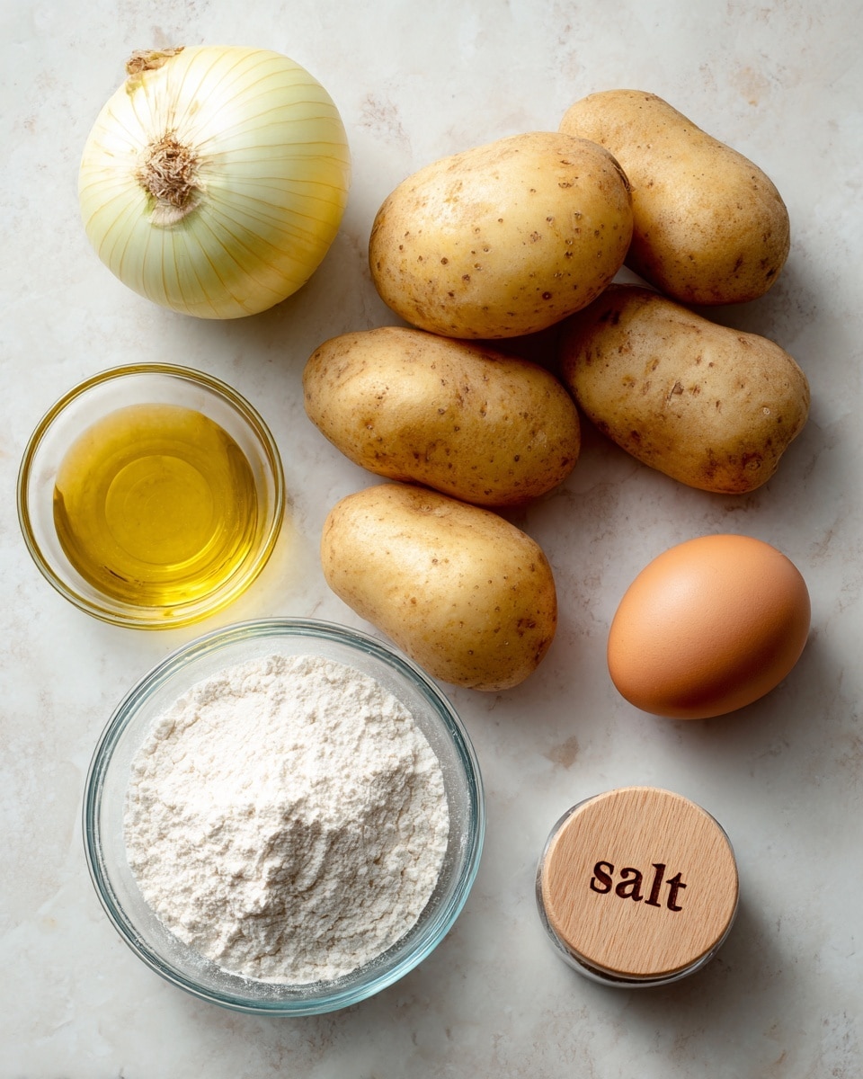 A flat lay of raw cooking ingredients placed on a white marbled texture, featuring one yellow onion on the top left, four pale brown potatoes in the center with one stacked on top, and a single brown egg to the right of the potatoes. To the bottom left, a small clear glass bowl holds a light yellow oil, while a small clear glass bowl filled with white flour is at the top right. To the bottom right, a small round container with a wooden lid labeled