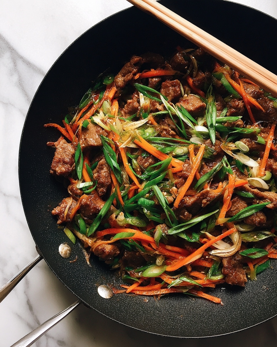 The image shows a black pan filled with cooked slices of meat covered in a creamy light brown sauce. Mixed in are thin strips of orange carrots, adding bright color contrast throughout the dish. On top, finely chopped green onions are sprinkled, giving a fresh green pop over the textured meat and sauce layers. A pair of wooden chopsticks is resting on the side of the pan, stirring the food slightly. The background is a white marbled texture. photo taken with an iphone --ar 4:5 --v 7