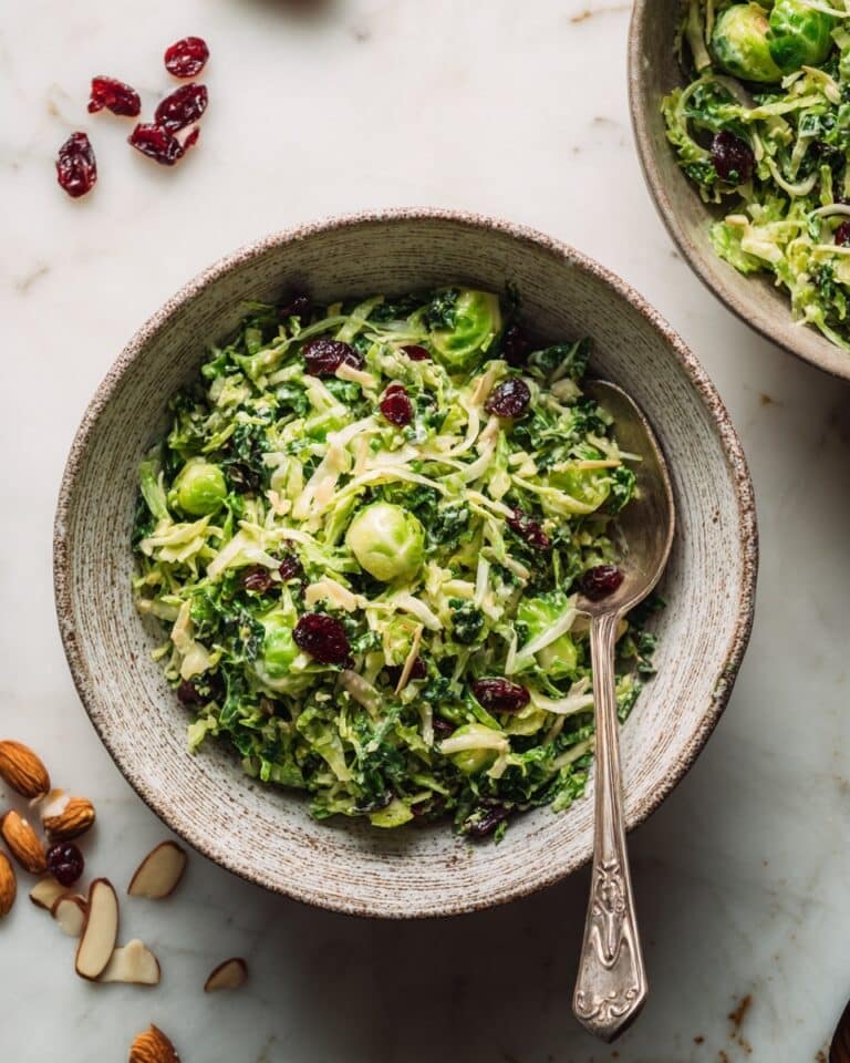 Kale and Brussels Sprout Salad with Lemon-Cranberry Dressing and Toasted Almonds Recipe