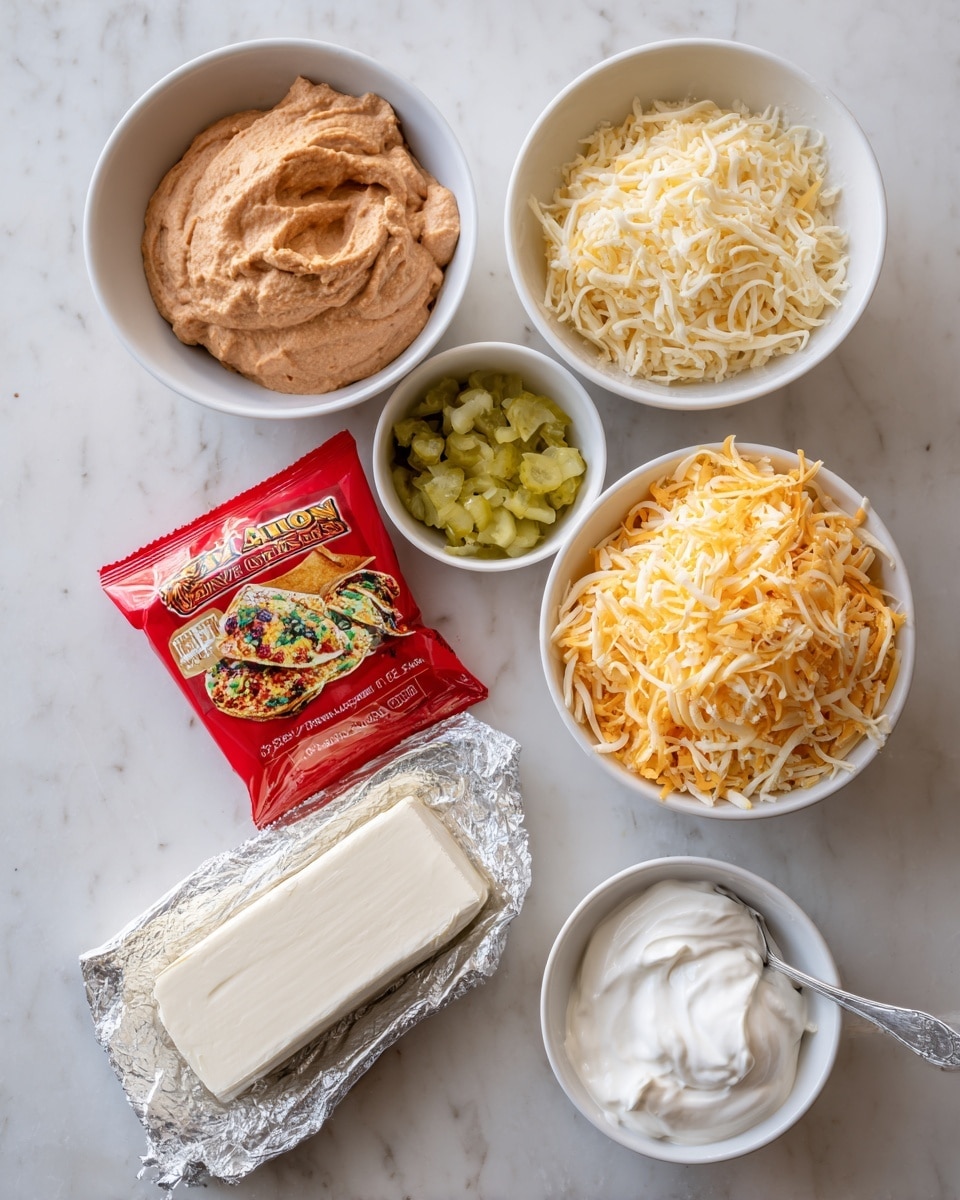 The image shows a white marbled surface with six items arranged. At the top left, there is a white bowl filled with light brown refried beans that have a smooth texture. To the top right, there is another white bowl with a mix of shredded yellow and white cheese with fine strands. Between these bowls, slightly below, there is a red packet of taco seasoning mix with a colorful taco image on it. Above the packet, there is a small white bowl containing chopped light green pickles. At the bottom left, there is a block of white cream cheese partially unwrapped from foil. Finally, at the bottom right, there is a spoon filled with white sour cream resting on the surface. Photo taken with an iphone --ar 4:5 --v 7