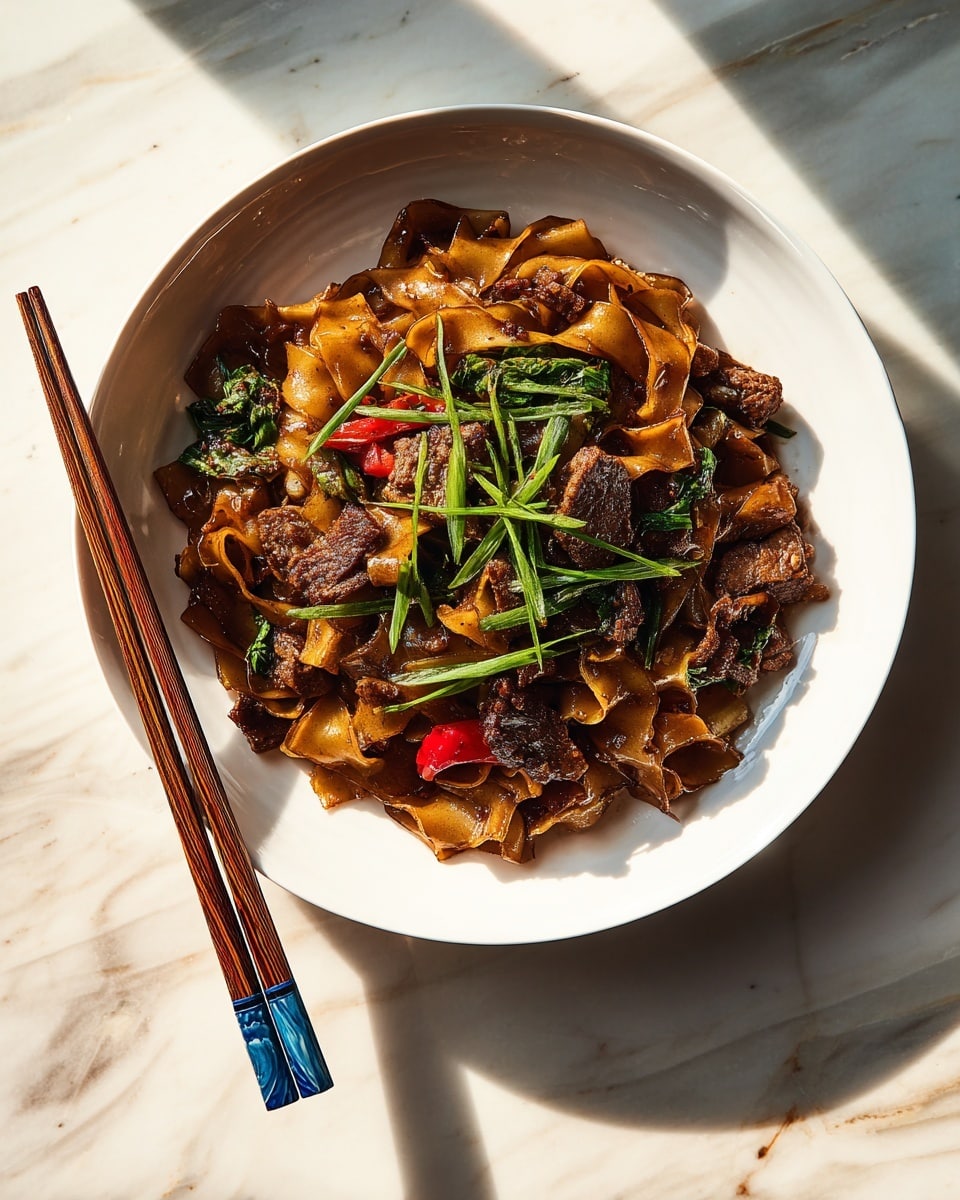 A large bowl filled with three main layers: at the bottom, wide, flat, amber-colored noodles with a slightly shiny texture; on top of the noodles, bright red and orange sliced bell peppers mixed with fresh green herb leaves; the top layer has small, browned pieces of cooked chicken sprinkled with white sesame seeds and sliced green onions. The bowl is placed on a surface with a white marbled texture, and some green leaves are visible around it. Sunlight casts warm shadows on the food, highlighting its colors and textures. Photo taken with an iphone --ar 4:5 --v 7