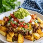 Crispy Taco Potatoes with Seasoned Ground Beef and Cheesy Toppings Recipe