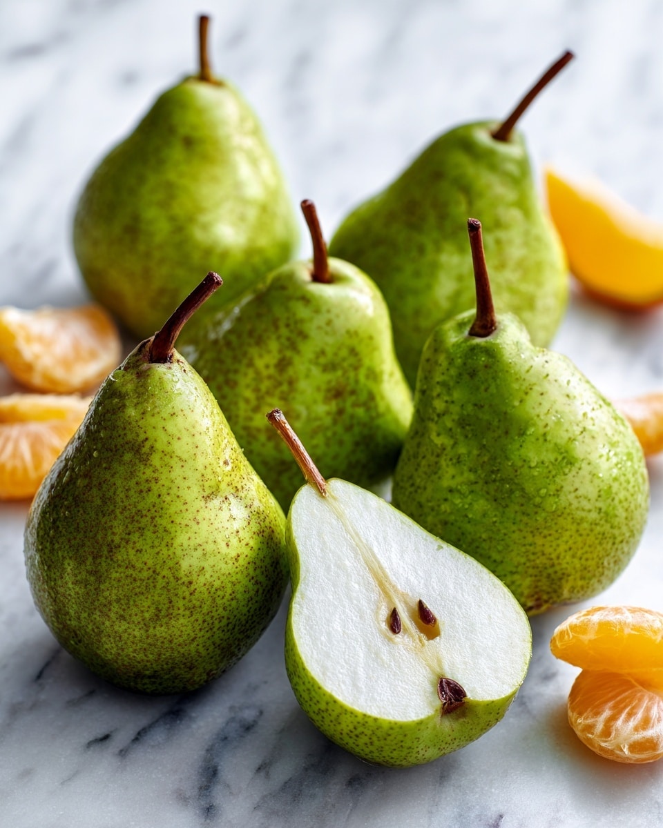 Five green pears with brown stems are placed on a white marbled surface. Four pears are whole, showing a smooth texture with some brown spots, and one pear lies sliced in half, revealing its white inside flesh. In the background, a few pieces of peeled orange are partially visible, adding a splash of bright orange color. The overall scene looks fresh and natural. photo taken with an iphone --ar 4:5 --v 7