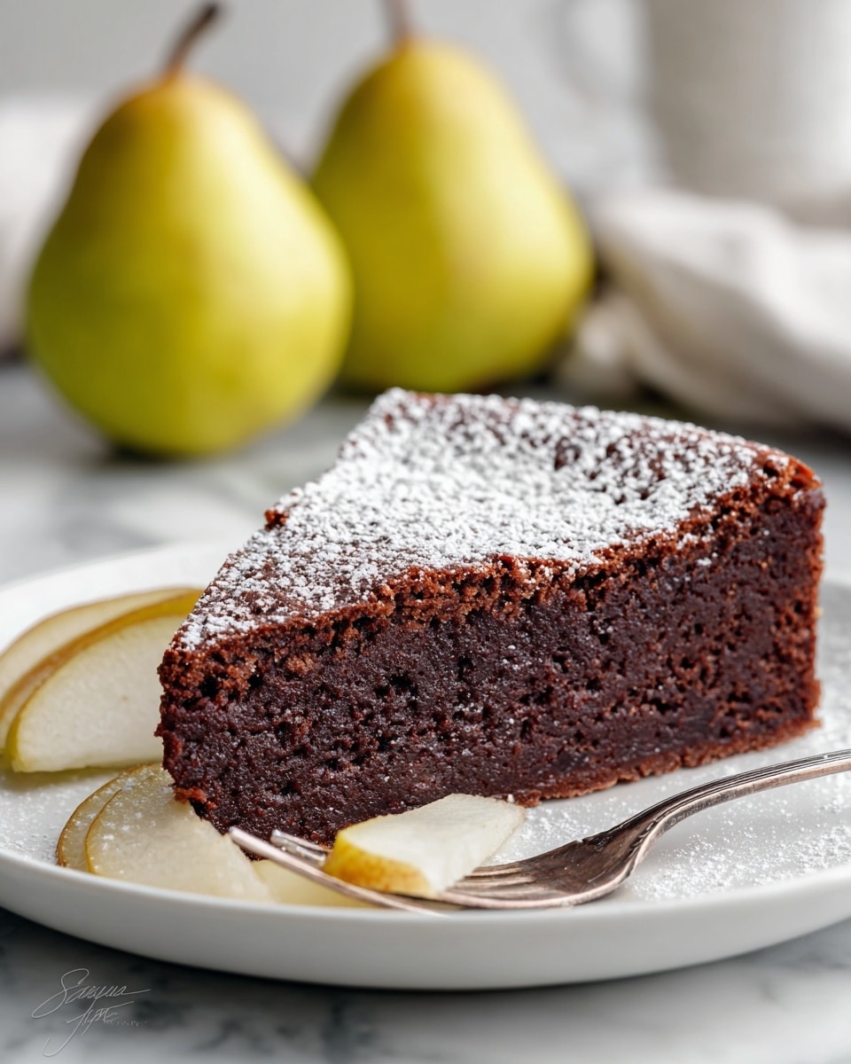 A round chocolate tart with scalloped edges sits on a white plate with a raised decorative border, placed on a white marbled surface. The tart has five pear halves, each fanned out with thin slices on top, evenly spaced around the tart. The dark brown tart is dusted with a light layer of powdered sugar, covering almost the entire top except for the exposed golden yellow pear slices. Around the plate, there are three whole yellow-green pears and a small white bowl holding a metal sieve with some powdered sugar inside. The photo taken with an iphone --ar 4:5 --v 7