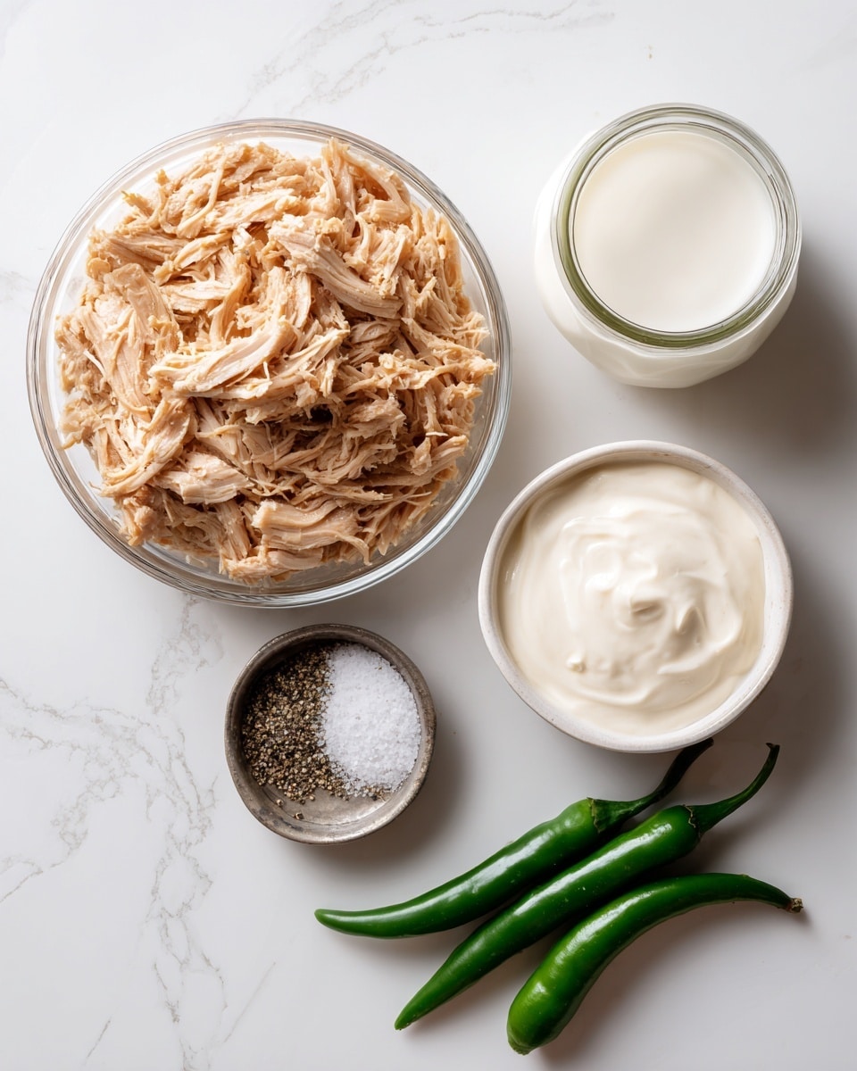 The image shows five ingredients on a white marbled surface: a clear round container filled with light brown shredded meat placed in the center, a white bowl on the top right filled with thick, creamy white mayonnaise, a small round metal container below the meat holding white salt and black pepper, a small glass jar directly to the right of the metal container filled with white milk, and two fresh green chili peppers lying diagonally at the bottom right. Photo taken with an iphone --ar 4:5 --v 7