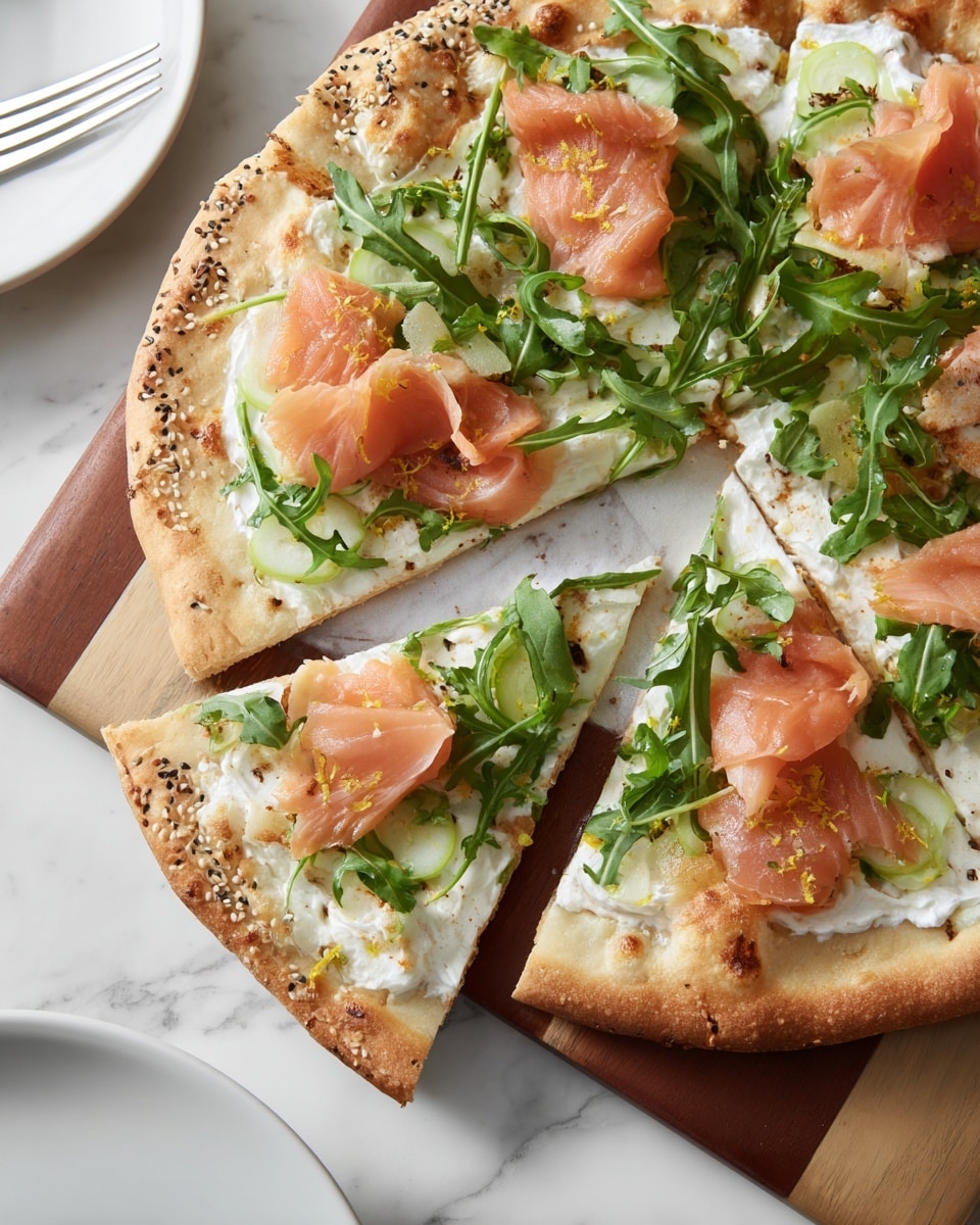 A thin, round pizza with a golden crust sprinkled with sesame and other seeds forms the base. The first layer is a creamy white cheese spread covering the crust. On top of that, there are slices of light pink smoked salmon evenly placed across the pizza. Thin round slices of green cucumber peek out under the salmon. Fresh, bright green arugula leaves are scattered generously over everything. There are small flecks of black pepper and lemon zest sprinkled on top, adding pops of yellow and black. The pizza has been cut into slices with one slice slightly pulled out, showing the clean edges and toppings. The background is a white marbled surface with part of a wooden board visible underneath the pizza, and a partial view of a white plate is seen at the bottom left. photo taken with an iphone --ar 4:5 --v 7
