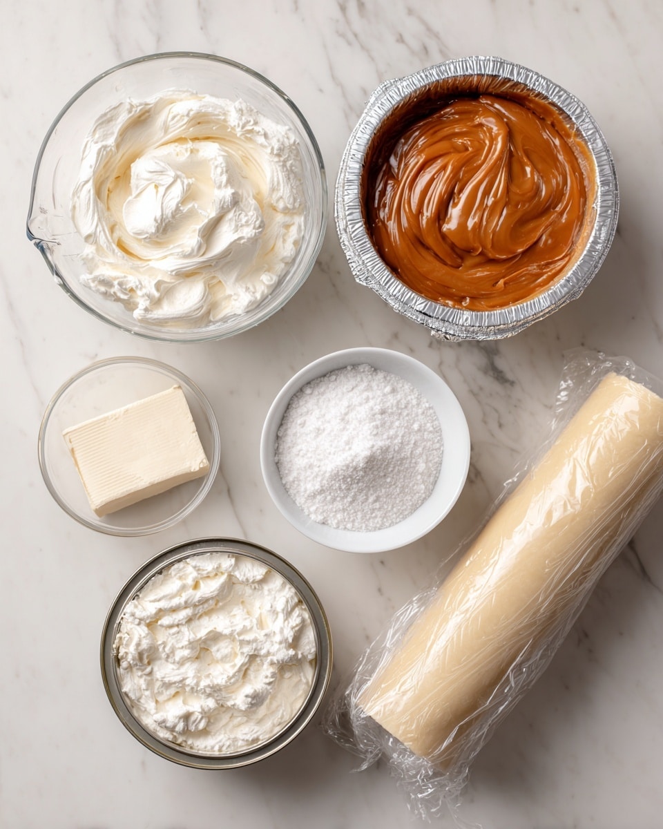 On a white marbled surface, there is a clear glass measuring cup filled with heavy whipping cream, a block of cream cheese resting on its open silver foil wrapper, a round, open can showing thick, smooth dulce de leche with a rich brown color, a small white bowl with powdered sugar that is fluffy and snow-white, a clear bowl with granulated white sugar, and a tightly rolled, light beige pie crust in plastic wrap positioned diagonally across the bottom right corner. Each ingredient is labeled with black text on white blocks near their respective items. photo taken with an iphone --ar 4:5 --v 7