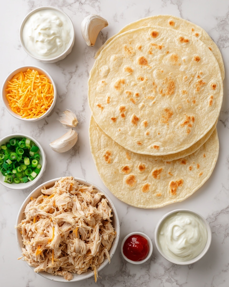 Two large soft yellow tortillas are placed flat on a white marbled surface, with a white bowl full of shredded light brown cooked chicken positioned just below them. Around the bowl, there are four small white dishes: one with bright orange shredded cheddar cheese, one with a creamy mix of white sour cream and mayonnaise, one with chopped green onions in a clear liquid, and one with a small amount of bright red hot sauce. A couple of whole garlic cloves sit beside the chicken bowl. The image is bright and clear, with a clean and simple arrangement. photo taken with an iphone --ar 4:5 --v 7