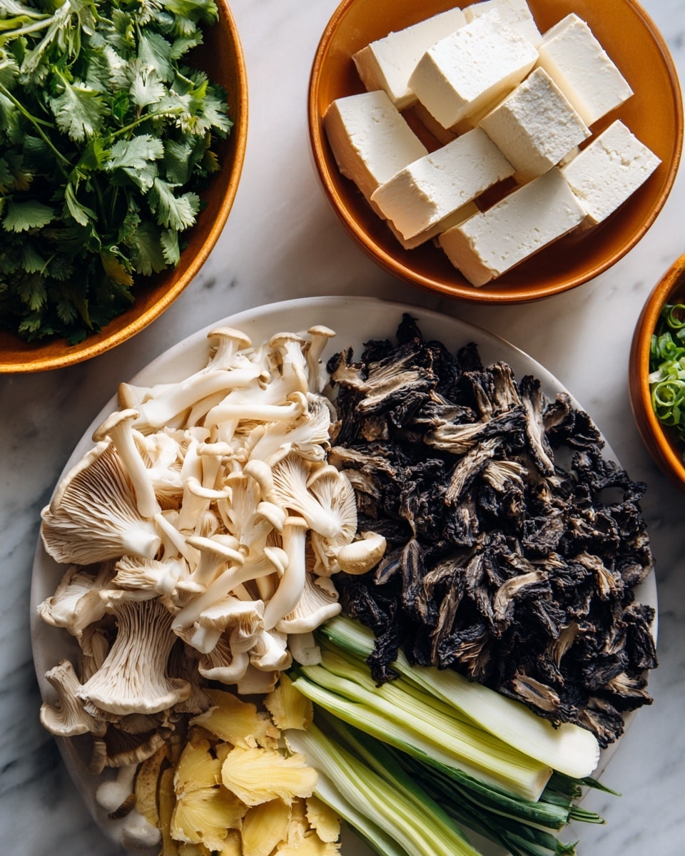 The image shows a close-up view of various fresh ingredients arranged on a white plate and two orange bowls, all placed on a white marbled surface. The white plate is filled with chopped mushrooms in two large groups: creamy white oyster mushrooms on the left and dark brown wood ear mushrooms on the right. Below the mushrooms, there are layers of light green vegetable stalks and small pieces of yellow ginger. Two orange bowls behind the plate hold different items; the left bowl contains firm white tofu cut into rectangular pieces, while the right bowl has fresh green cilantro leaves and curly green scallions. The overall setup looks clean, fresh, and ready for cooking. Photo taken with an iphone --ar 4:5 --v 7