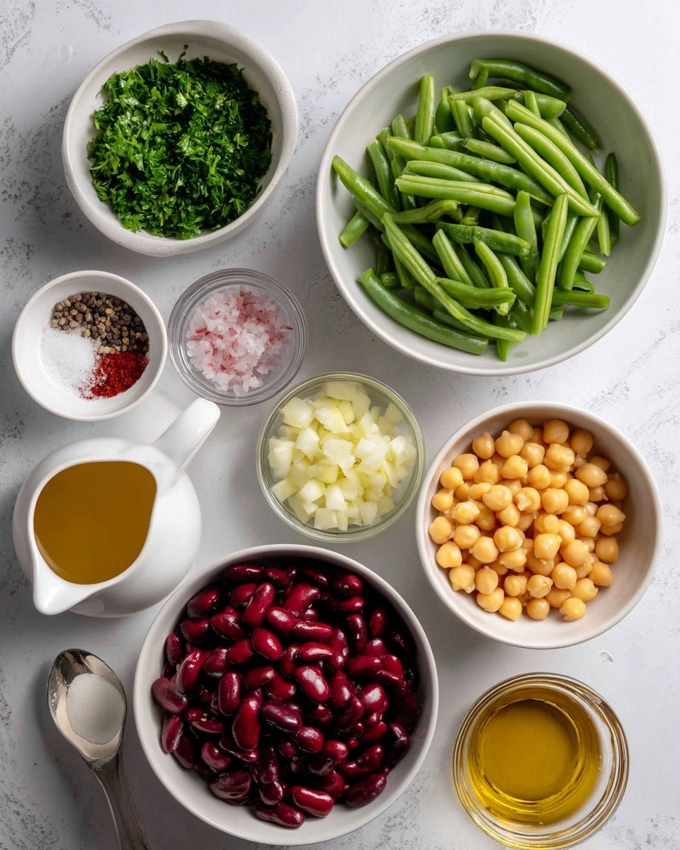 The image shows several small white bowls arranged on a white marbled surface, each holding a different ingredient. From top left, there is a bowl filled with finely chopped bright green parsley leaves. To the right, a larger white bowl contains fresh, cut green beans with a smooth texture. Below the parsley, a white bowl is filled with dark red kidney beans, smooth and shiny. Next to it, on the right, a white bowl holds round, yellow chickpeas. Around these bowls are smaller containers with light yellow diced onion, a small glass bowl with a mix of pink salt and black pepper, a tiny white spoon with chopped white garlic, a small white jug with golden olive oil, a small glass bowl filled with amber maple syrup, and another glass bowl with light amber apple cider vinegar. All ingredients are neatly arranged on the white marbled background. Photo taken with an iphone --ar 4:5 --v 7