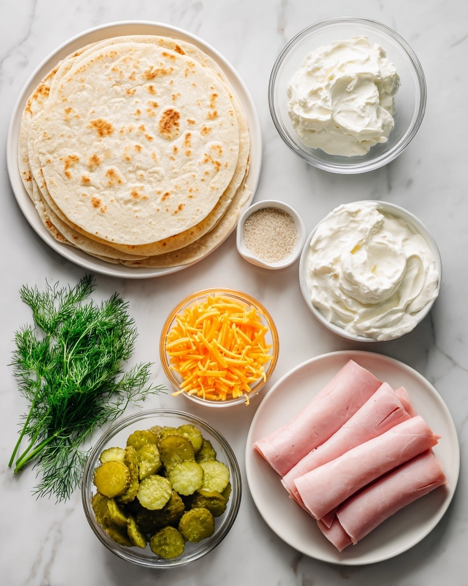 The image shows ingredients arranged neatly on a white marbled surface for making a rolled tortilla dish. There is a stack of four round flour tortillas on a white plate on the left side. Next to it, in small clear glass bowls, are dollops of white cream cheese and sour cream, both smooth in texture. Below them is a bowl of chopped green dill pickles with a fresh bunch of green dill in another small glass bowl. A small white bowl holds a fine beige ranch seasoning mix. There is a small pile of shredded bright orange cheddar cheese scattered slightly on the surface. On the right side, a white plate holds four neat rolls of pink deli ham. The colors and textures are clear and fresh, all set against the clean white background. Photo taken with an iphone --ar 4:5 --v 7
