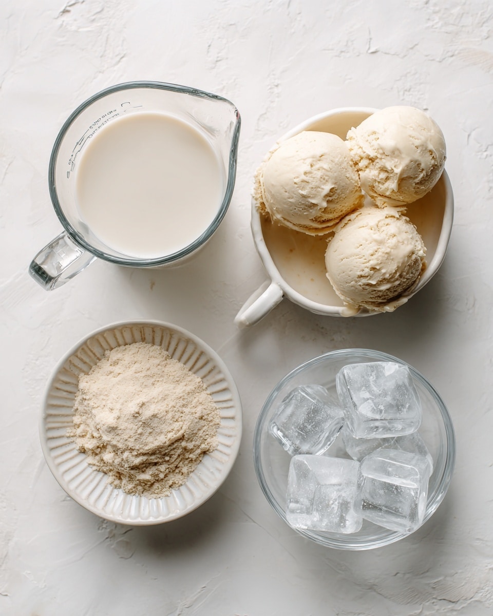 A top-down view of four containers arranged roughly in a square on a white marbled surface, each labeled with text: a clear glass measuring cup filled with smooth, pale off-white almond milk on the top left; a white ceramic bowl with a handle on the top right holding three scoops of creamy, pale yellow vanilla ice cream; a small white ceramic bowl with ridged edges at the bottom left full of light beige vanilla protein powder with a powdery texture; and a clear round glass bowl on the bottom right containing large, translucent white ice cubes. The whole setup is clean and bright with soft natural light, photo taken with an iphone --ar 4:5 --v 7