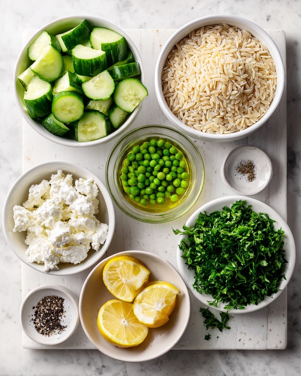 Top view of several small white bowls and a glass cup arranged on a white marbled surface, each bowl holding different ingredients: one bowl filled with light beige orzo pasta grains on the right, below it a small bowl with bright green chopped parsley, and next to the parsley a white bowl with crumbly white feta cheese. On the left side, there are two white bowls, one with fresh cucumber pieces cut into chunks and the other filled with bright green frozen peas. Below these, a glass cup contains golden olive oil, a white bowl holds lemon halves with visible juicy flesh, and the last small white bowl has a mixture of white salt and black pepper granules. All ingredients are neatly placed, with clear labels over each item. Photo taken with an iphone --ar 4:5 --v 7