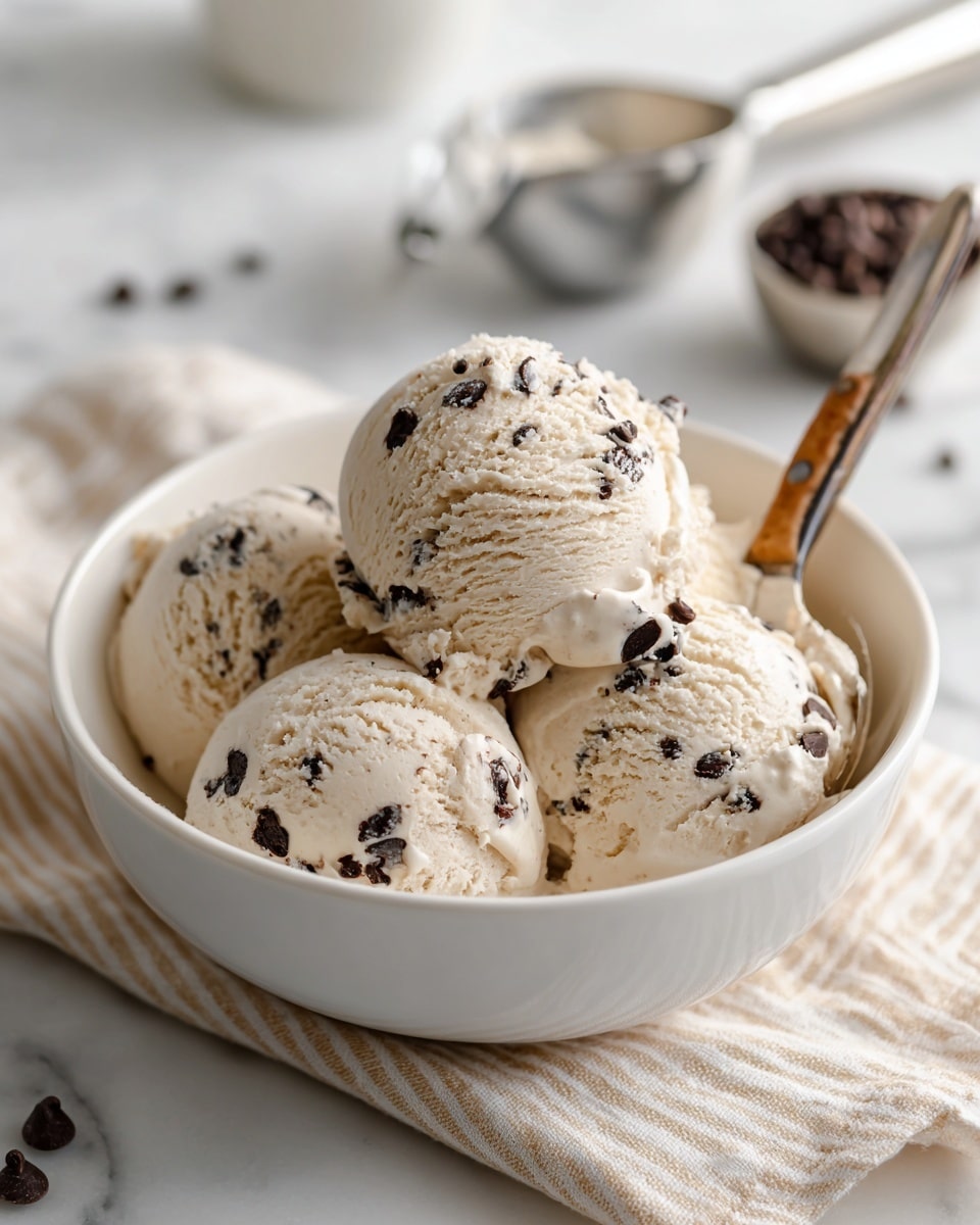 The image shows four white bowls arranged on a white marbled surface. The largest bowl in the center is filled with white, lumpy cottage cheese, showing its textured, soft curds. To the top left, a small glass container holds golden honey, with a smooth and shiny liquid texture. On the top right, a small white bowl is filled with dark brown, flat, round chocolate chips, creating a shiny and smooth contrast. At the bottom, another white bowl contains creamy, light brown peanut butter with a smooth surface and some visible peanut pieces. Each bowl is labeled clearly with simple black and white text. Photo taken with an iphone --ar 4:5 --v 7