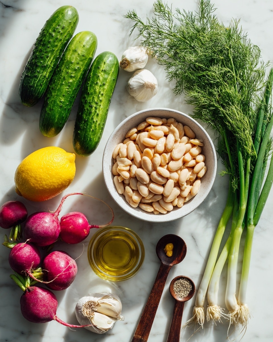 The image shows all the ingredients neatly arranged on a white marbled surface. In the center, there is a white bowl filled with pale beige white beans. Above the bowl, a fresh bunch of green dill with feathery leaves lies horizontally. To the left, two green cucumbers with smooth skin are placed side by side. Below the cucumbers, three radishes in shades of purple, red, and white are clustered. Near the bottom left corner, there is a halved yellow lemon with visible juicy segments. Below the lemon, a small glass bowl holds golden olive oil. To the right of the oil, two wooden-handled measuring spoons contain light brown Dijon mustard and white salt. Below these, three green onions with white bulbs and long green stalks stretch out horizontally near the bottom. A small garlic clove is placed above the bowl of white beans. The lighting is bright and natural. Photo taken with an iphone --ar 4:5 --v 7