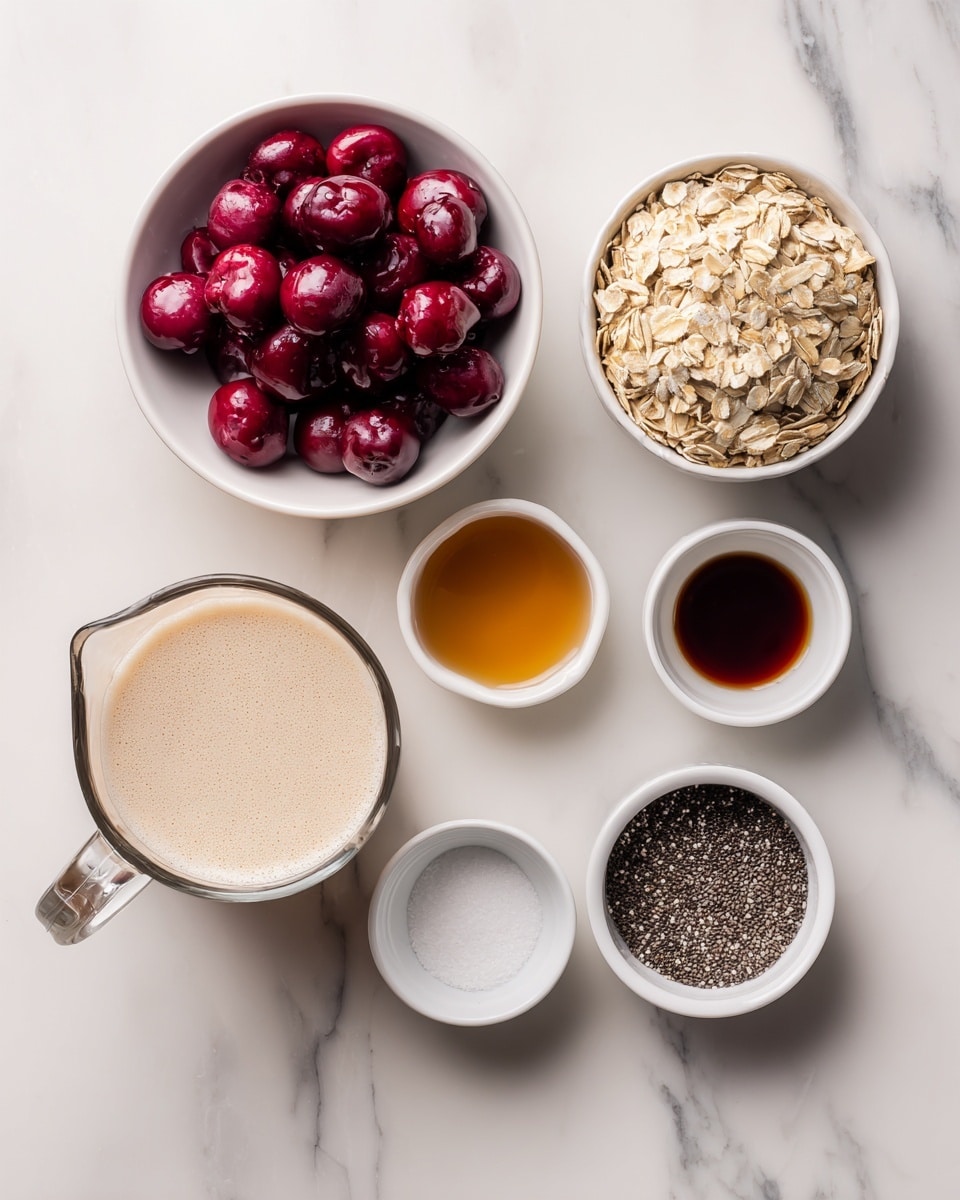 The image shows seven bowls and a measuring cup arranged on a white marbled surface. In the top left, a white bowl holds deep red fresh or frozen cherries. To its right is a small clear bowl filled with amber maple syrup. Below the cherries, three small white bowls hold almond extract (clear liquid), dark vanilla extract, and white salt respectively, arranged vertically. In the middle right, a large white bowl is full of light brown rolled oats with a rough texture. At the bottom left, a clear glass measuring cup holds frothy non-dairy milk with a creamy color. Finally, a small white bowl with black chia seeds is at the bottom right. Each ingredient is clearly visible with simple colors and textures, set on a clean white marbled background. photo taken with an iphone --ar 4:5 --v 7
