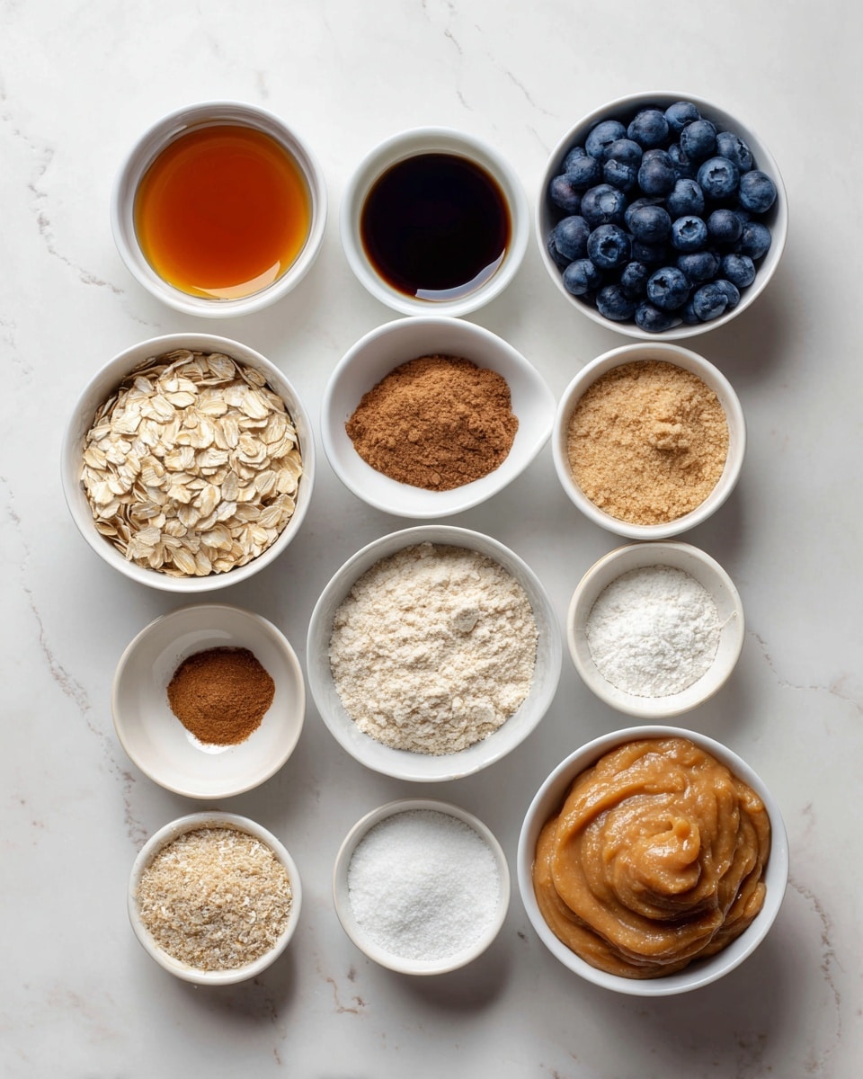 The image shows 12 small white bowls arranged neatly on a white marbled surface. The top left bowl contains smooth, dark amber maple syrup. To its right is a tiny white bowl with dark brown vanilla extract, and next to that is a larger white bowl filled with plump, deep blue blueberries. Below the syrup, a white bowl holds light beige rolled oats with a rough texture. Next, a tiny bowl with brown cinnamon powder sits above a small bowl with white salt. To the right of these, a larger white bowl is filled with pale, crumbly almond flour. Below the oats, a white bowl contains fine, light oat flour. In the center bottom, a small bowl holds fluffy white baking powder. To the left bottom corner, there is a small bowl with finely ground light brown flaxseed. Next to it, a larger bowl with thick, smooth, light brown almond butter appears. Finally, a white bowl filled with chunky light orange applesauce completes the scene. photo taken with an iphone --ar 4:5 --v 7