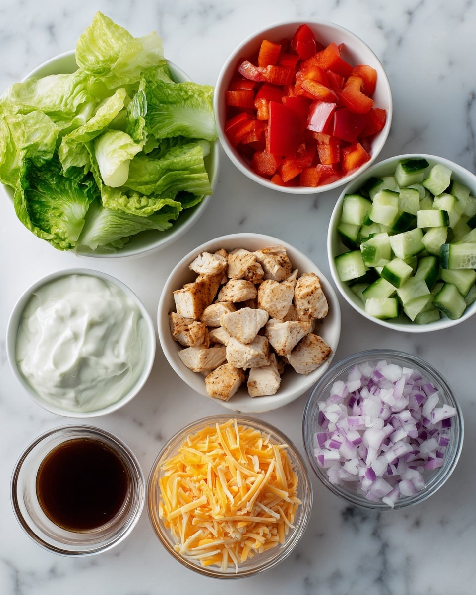 The image shows seven small bowls arranged on a white marbled surface. The top left bowl contains bright green romaine lettuce leaves with a fresh, crisp texture. To the right, a white bowl holds diced red bell pepper and light green cucumber pieces, both cut into small cubes. Below the lettuce, a white bowl is filled with creamy white ranch dressing, looking smooth and thick. In the center, another white bowl showcases chunks of cooked chicken in pale tan and light brown colors. To the right, there is a small clear bowl with finely diced light purple onions. At the bottom left, a white bowl contains dark brown hot honey sauce with a glossy surface. Lastly, on the bottom right, a clear bowl holds shredded cheddar cheese in vibrant yellow and orange shades. photo taken with an iphone --ar 4:5 --v 7